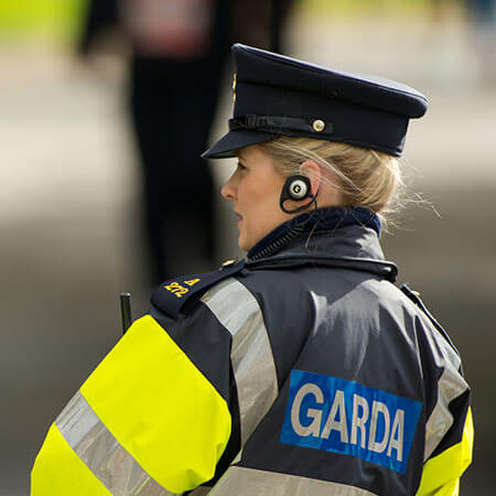 female Garda maintaining people's safety in dublin street