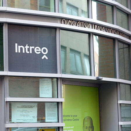 income tax funded intreo building on dublin's bishop street with sign above green door