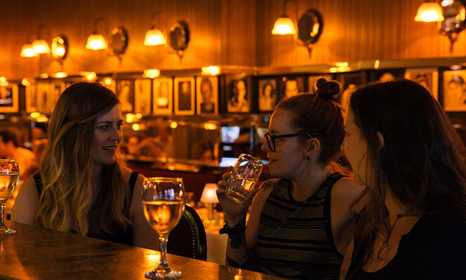 Female friends having a drink in a bar