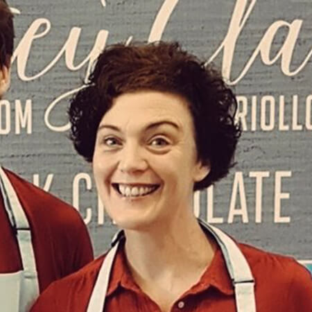 founder of chocolatey clare wearing a red shirt and apron