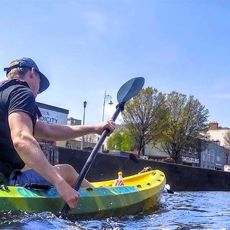 City Kyaking guide, Johnathon, paddling along Dublin's River Liffey
