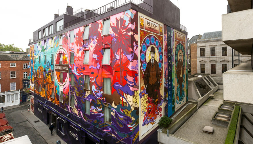 colourful street art on bloom's hotel by james earley