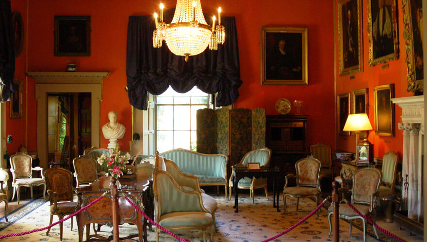 chandeliers, portraits and antique furniture on display in malahide castle
