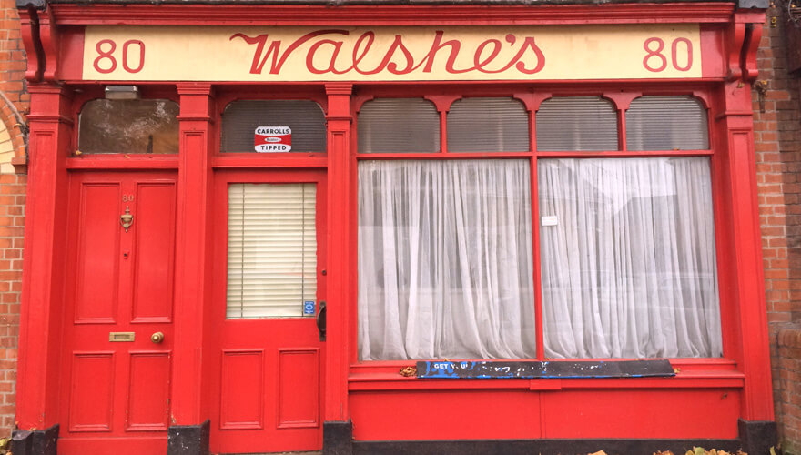 the bright red shopfront of walshe's on fairview strand