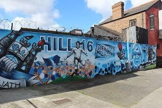 blue and navy mural of hill 16 and dublin team on wall in ballybough